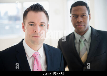 Close up of serious businessmen in office Stock Photo