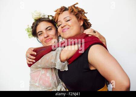 Stylish smiling women hugging Stock Photo