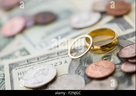 Close up of wedding rings with money Stock Photo