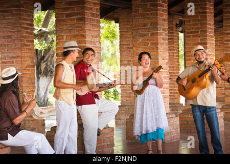 Musicians performing in courtyard Stock Photo
