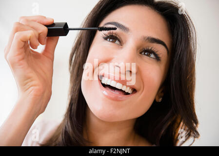 Close up of woman applying makeup Stock Photo