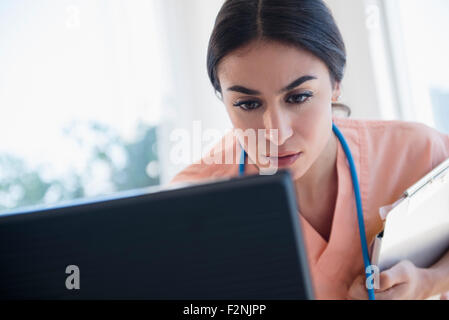 Nurse using computer in hospital Stock Photo