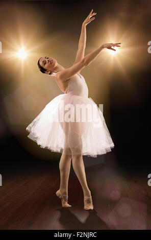 Hispanic ballet dancer performing on stage Stock Photo