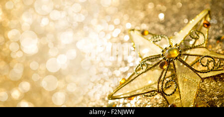 Decorative golden star on abstract background,Closeup. Stock Photo