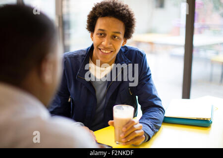 Men drinking coffee in cafe Stock Photo