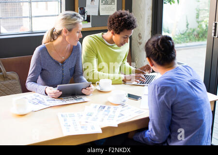 Business people using technology in office meeting Stock Photo
