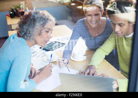 Business people using laptop in office meeting Stock Photo