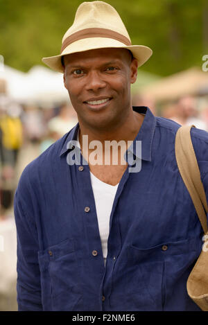 African American man wearing hat and tote bag Stock Photo