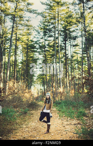 Caucasian woman standing on dirt path Stock Photo