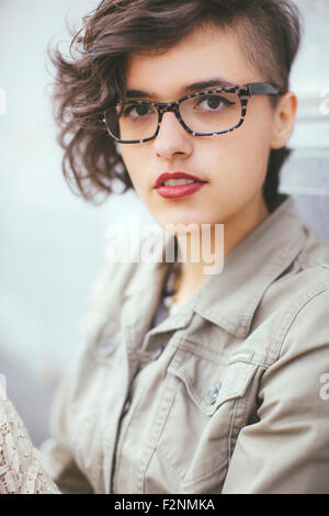 Stylish Caucasian woman wearing eyeglasses Stock Photo
