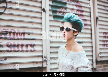 Caucasian woman walking at warehouse Stock Photo