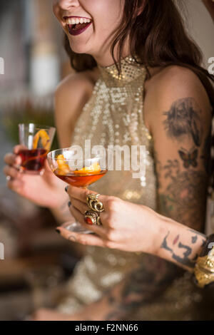 Close up of Caucasian women drinking cocktails Stock Photo