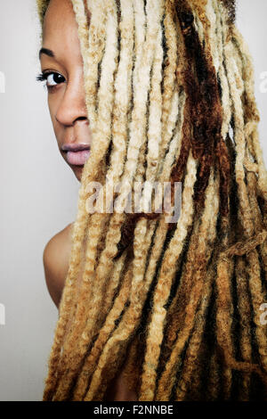 Close up of Black woman with dreadlocks Stock Photo