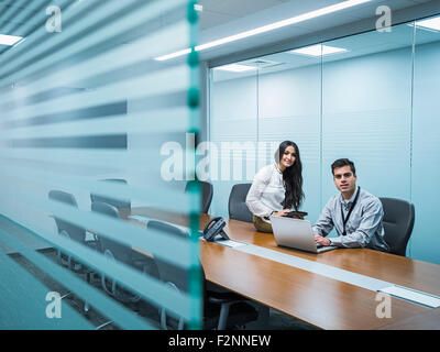Business people smiling in conference room