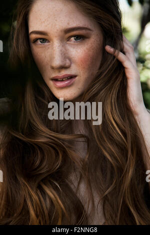 Caucasian woman with long hair and freckles Stock Photo