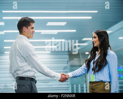 Business people shaking hands in office Stock Photo