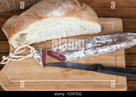 Traditional Catalan "Fuet" a Catalan thin, cured, dry sausage of pork meat in a pork gut. Stock Photo