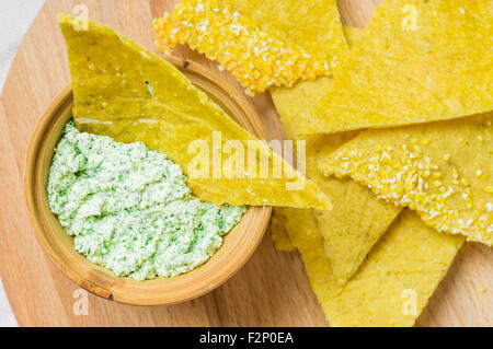 Homemade corn chips nachos with sauce top view Stock Photo