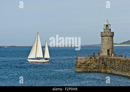 Classic yacht under sail arriving in St Peter Port Harbour Guernsey Channel Islands Stock Photo