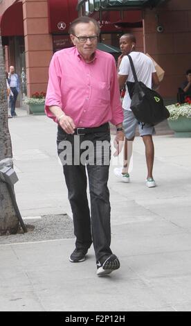 Larry King goes shopping in Beverly Hills in a pink shirt, jeans and Nike sneakers  Featuring: Larry King Where: Los Angeles, California, United States When: 21 Jul 2015 Stock Photo