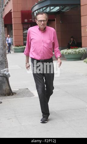 Larry King goes shopping in Beverly Hills in a pink shirt, jeans and Nike sneakers  Featuring: Larry King Where: Los Angeles, California, United States When: 21 Jul 2015 Stock Photo