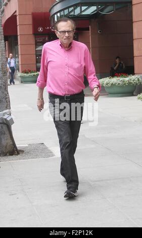 Larry King goes shopping in Beverly Hills in a pink shirt, jeans and Nike sneakers  Featuring: Larry King Where: Los Angeles, California, United States When: 21 Jul 2015 Stock Photo