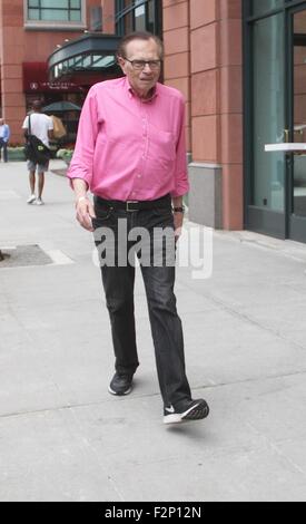 Larry King goes shopping in Beverly Hills in a pink shirt, jeans and Nike sneakers  Featuring: Larry King Where: Los Angeles, California, United States When: 21 Jul 2015 Stock Photo