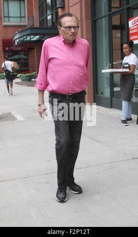 Larry King goes shopping in Beverly Hills in a pink shirt, jeans and Nike sneakers  Featuring: Larry King Where: Los Angeles, California, United States When: 21 Jul 2015 Stock Photo