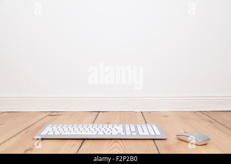 keyboard and mouse on wooden floor Stock Photo
