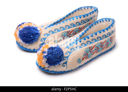 Traditional greek woollen handmade slippers isolated on white Stock Photo