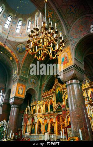 Helsinki, Finland. Saint portraits on the iconostasis and massive pillars of The Finnish Orthodox Uspenski Cathedral. Consecrate Stock Photo