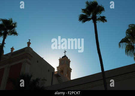 Middle East, summer day: birds flying on the bell tower of Saint Peter's Church in old city of Jaffa, Tel Aviv Yafo, Israel Stock Photo