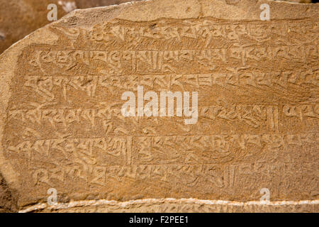 India, Jammu & Kashmir, Ladakh, Saspul, mani stone inscribed with Tibetan scrip mantra Stock Photo