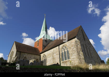 St Mary and St Gabriel Parish Church in the village of South Harting, West Sussex. Low angle shot from below the churchyard level. Stock Photo
