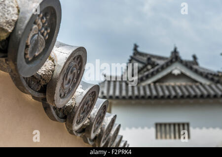 Ornate detailing on the end of the roof tiles at Himeji Castle in Japan Stock Photo