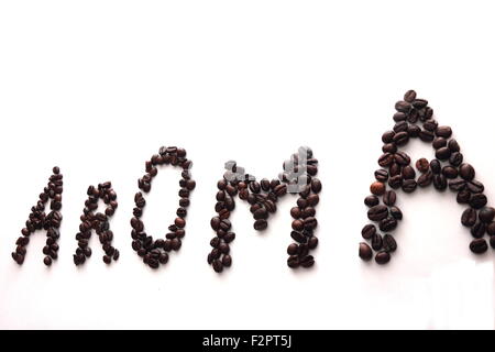 laid out on a white background the word aroma of coffee beans Stock Photo