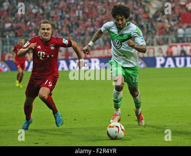 Munich, Germany. 22nd Sep, 2015. Bayern's Robert Mario Gotze(L) vies with Wolfsburg's Dante during the German Bundesliga soccer match between FC Bayern Munich and VfL Wolfsburg at the Allianz Arena stadium in Munich, Germany, Sept. 22, 2015. Lewandowski made Bundesliga history on Tuesday after scoring five goals in the space of nine minutes as Bayern Munich rout Wolfsburg 5-1. © Philippe Ruiz/Xinhua/Alamy Live News Stock Photo