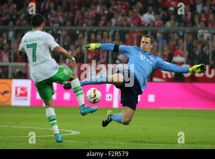 Munich, Germany. 22nd Sep, 2015. Bayern's Manuel Neuer (R) tries to save the ball during the German Bundesliga soccer match between FC Bayern Munich and VfL Wolfsburg at the Allianz Arena stadium in Munich, Germany, Sept. 22, 2015. Lewandowski made Bundesliga history on Tuesday after scoring five goals in the space of nine minutes as Bayern Munich rout Wolfsburg 5-1. © Philippe Ruiz/Xinhua/Alamy Live News Stock Photo