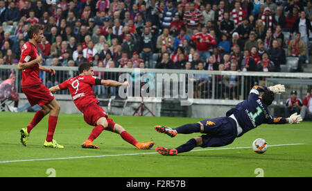 Munich, Germany. 22nd Sep, 2015. Bayern's Robert Lewandowski (C) shoots during the German Bundesliga soccer match between FC Bayern Munich and VfL Wolfsburg at the Allianz Arena stadium in Munich, Germany, Sept. 22, 2015. Lewandowski made Bundesliga history on Tuesday after scoring five goals in the space of nine minutes as Bayern Munich rout Wolfsburg 5-1. © Philippe Ruiz/Xinhua/Alamy Live News Stock Photo