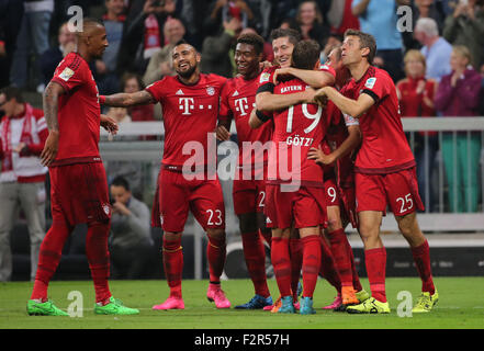 Munich, Germany. 22nd Sep, 2015. Bayern's Robert Lewandowski (C) celebrates with teammates during the German Bundesliga soccer match between FC Bayern Munich and VfL Wolfsburg at the Allianz Arena stadium in Munich, Germany, Sept. 22, 2015. Lewandowski made Bundesliga history on Tuesday after scoring five goals in the space of nine minutes as Bayern Munich rout Wolfsburg 5-1. © Philippe Ruiz/Xinhua/Alamy Live News Stock Photo