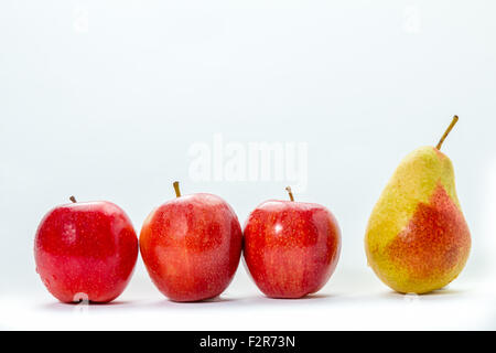 Three Apple one pear isolated on white background Stock Photo
