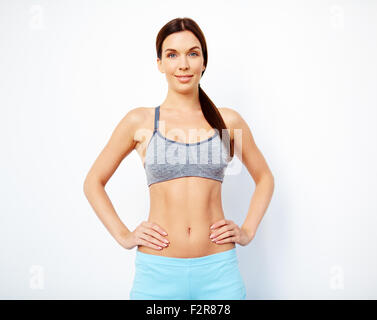 Fit woman in activewear looking at camera Stock Photo