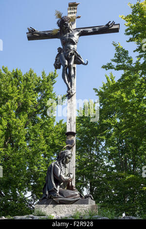 Jesus on the cross and figure of a saint, Calvary, Bad Tölz, Upper Bavaria, Bavaria, Germany Stock Photo