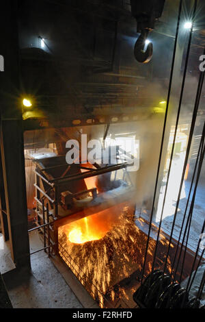 molten metal poured from ladle in steel plant Stock Photo