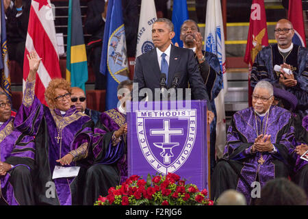 U.S. President Barack Obama surrounded by Bishops from the AME Church delivers the eulogy at the funeral of slain State Senator Clementa Pinckney at the TD Arena June 24, 2015 in Charleston, South Carolina. Pinckney is one of the nine people killed in last weeks Charleston church massacre. Stock Photo