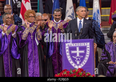 U.S. President Barack Obama surrounded by Bishops from the AME Church delivers the eulogy at the funeral of slain State Senator Clementa Pinckney at the TD Arena June 24, 2015 in Charleston, South Carolina. Pinckney is one of the nine people killed in last weeks Charleston church massacre. Stock Photo