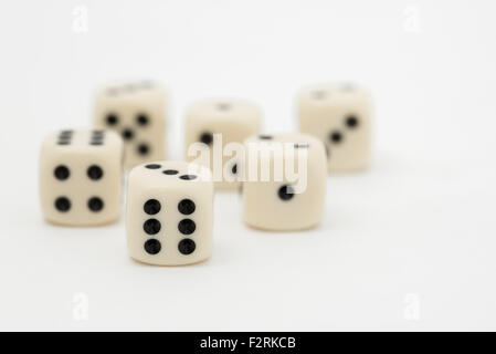 Six dice on a white background.  Showing all sides from one to six Stock Photo