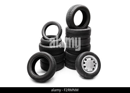 Studio shot of  black car tires piled up in two separate stacks isolated on white background Stock Photo