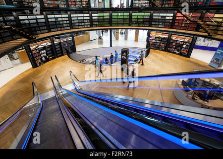 The illuminated escalators in the new Library of Birmingham, England Stock Photo