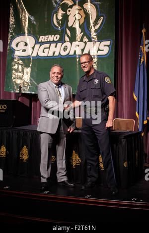 Reno, Nevada, USA. 23rd Sep, 2015. Reno Police Chief Soto congratulates Reno Bighorn Managing Owner Herb Santos, Jr. before the press conference announcing the extension of the agreement between the Sacramento Kings and the Reno Bighorns, Reno, NV © Jeff Mulvihill Jr/ZUMA Wire/Alamy Live News Stock Photo